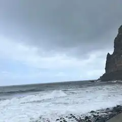 stormy ocean waves crashing near cliff