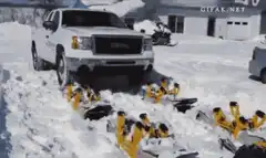 White GMC truck with yellow snow tracks