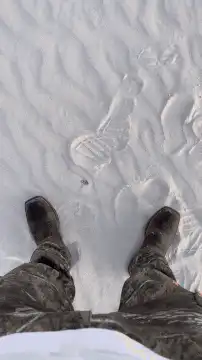 First person view walking in white sand dunes