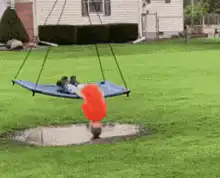 Kid on swing dips head in mud puddle