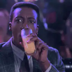 Clifford Bailey drinks and reacts