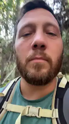 Man with backpack in forest