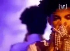 The Weeknd holding pearls to his face