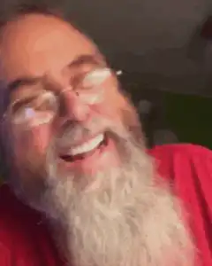 Man with long beard laughing