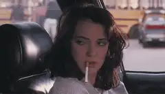 Winona Ryder smoking in a car