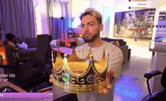 KSI holds a gold crown