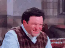 Cosmo Kramer nodding and smiling