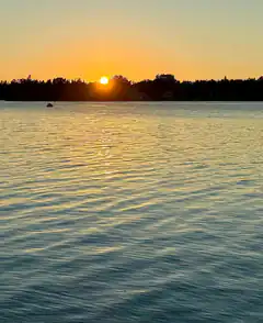 Sunset over calm water
