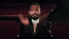 Man in tuxedo clapping