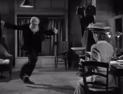 Old man dancing for a woman