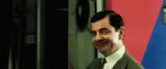 Mr. Bean waving and smiling
