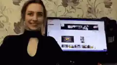 Girl smiling at camera with YouTube open