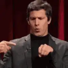 Andy Samberg pointing at fist
