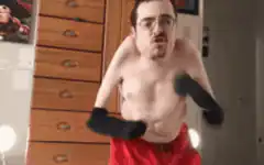 shirtless man boxing with socks