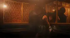 Couple kissing in a dimly lit room