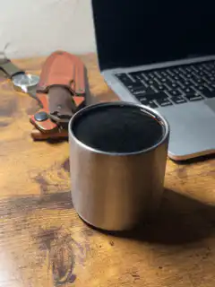 Steam rising from a metal cup