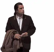 John Travolta looking around confused