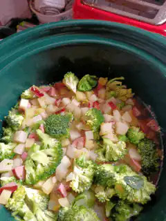 Pouring Nantucket Nectars into a slow cooker