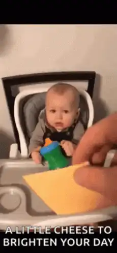 Baby gets cheese on face