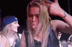 Gigi Hadid dancing at a concert