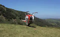 Helicopter bouncing on a hillside