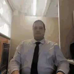 Man turns around in chair