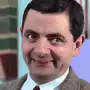Mr. Bean smirking and winking