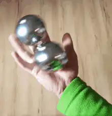 Hand juggling two metal balls