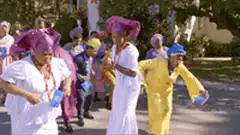women in colorful traditional outfits dancing