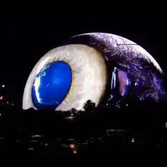 Giant eye opening and closing at night