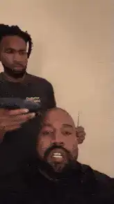Kanye West getting a haircut
