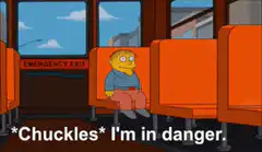 Ralph Wiggum chuckles on the bus