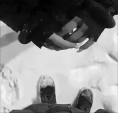 Person holding hands in snow