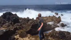 Man gets hit by a giant wave