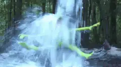 green monster under waterfall