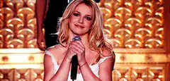 Britney Spears winking with microphone