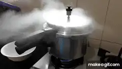 Pressure cooker releasing steam