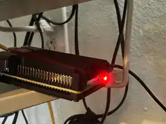 Red laser beam shoots from device