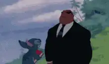 Stitch throws a book at Agent K