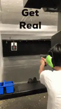 Woman shooting gun at range
