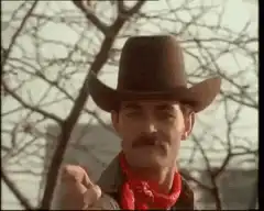 Man in cowboy hat gives thumbs up