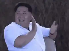 Kim Jong Un clapping and laughing