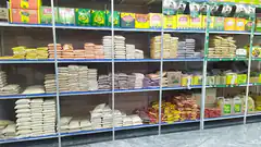 grocery store shelves stocked with rice and pasta