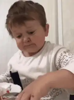 Toddler eating cake and snapping fingers