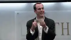 Michael Scott throws money in the air