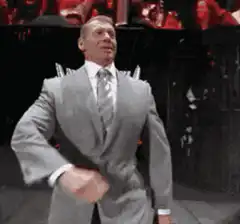 Vince McMahon walking with WWE logo