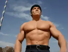Arnold Schwarzenegger flexing muscles
