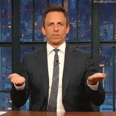 Seth Meyers shrugs and points