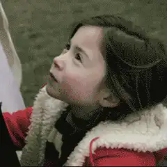 Girl in red coat smiles