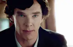 Sherlock smirks and looks down